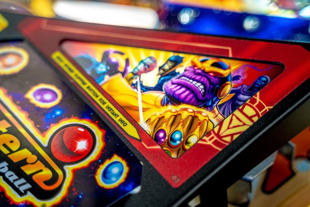 Close-up of a colorful arcade game with a character design on the screen.