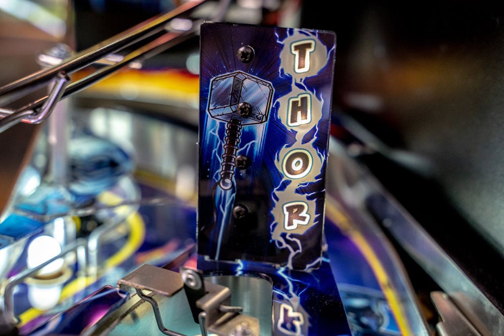 Pinball machine with 'Thor' theme and blue and purple design