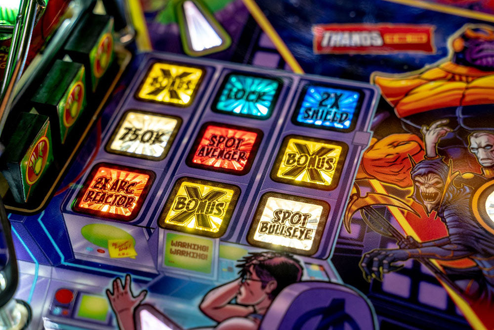 Close-up of a pinball machine with colorful buttons and graphics