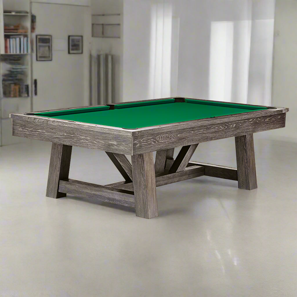 A dark charcoal Brunswick American pool table with green felt top positioned in a room with a contemporary design.