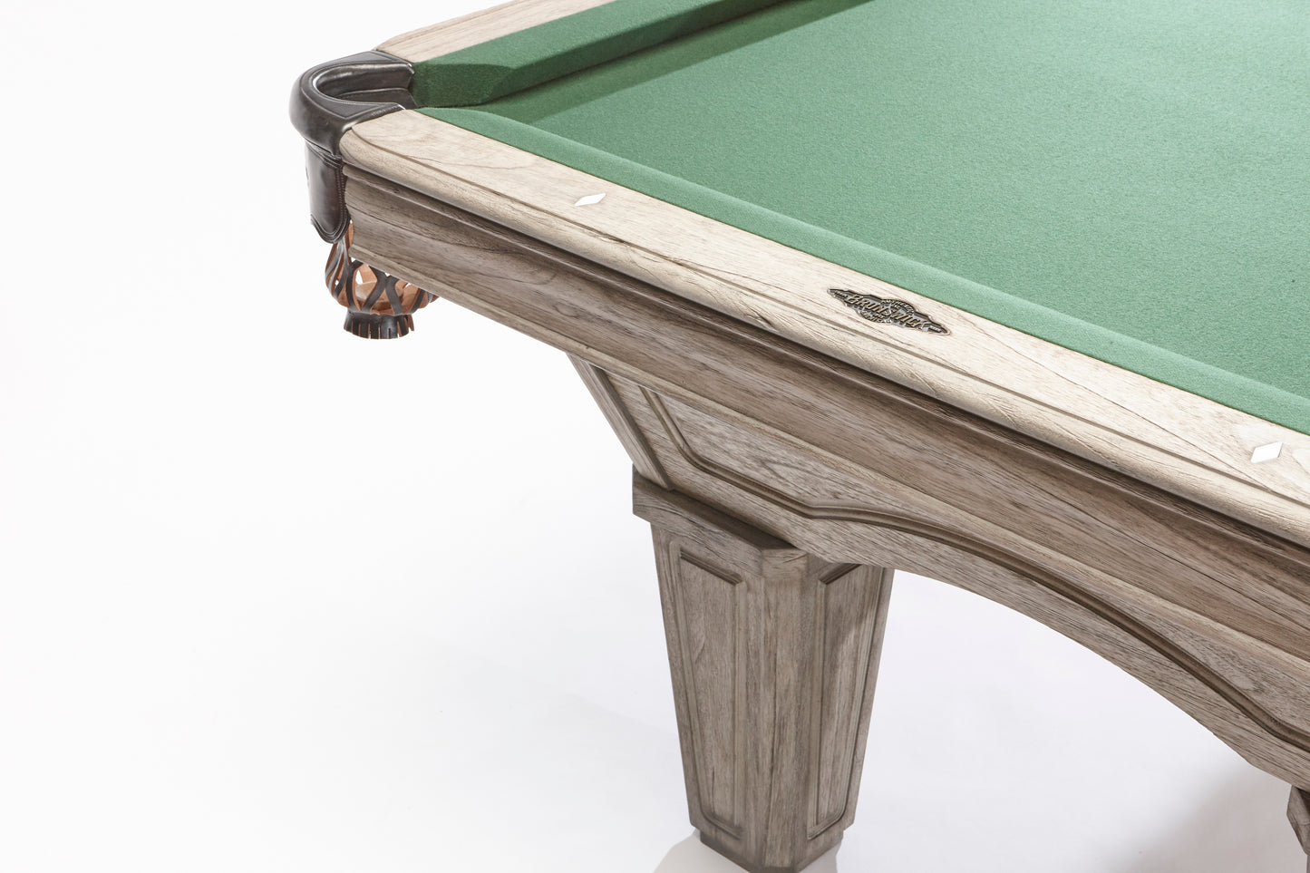 Close-up of a pool table with green felt and wooden frame on a white background