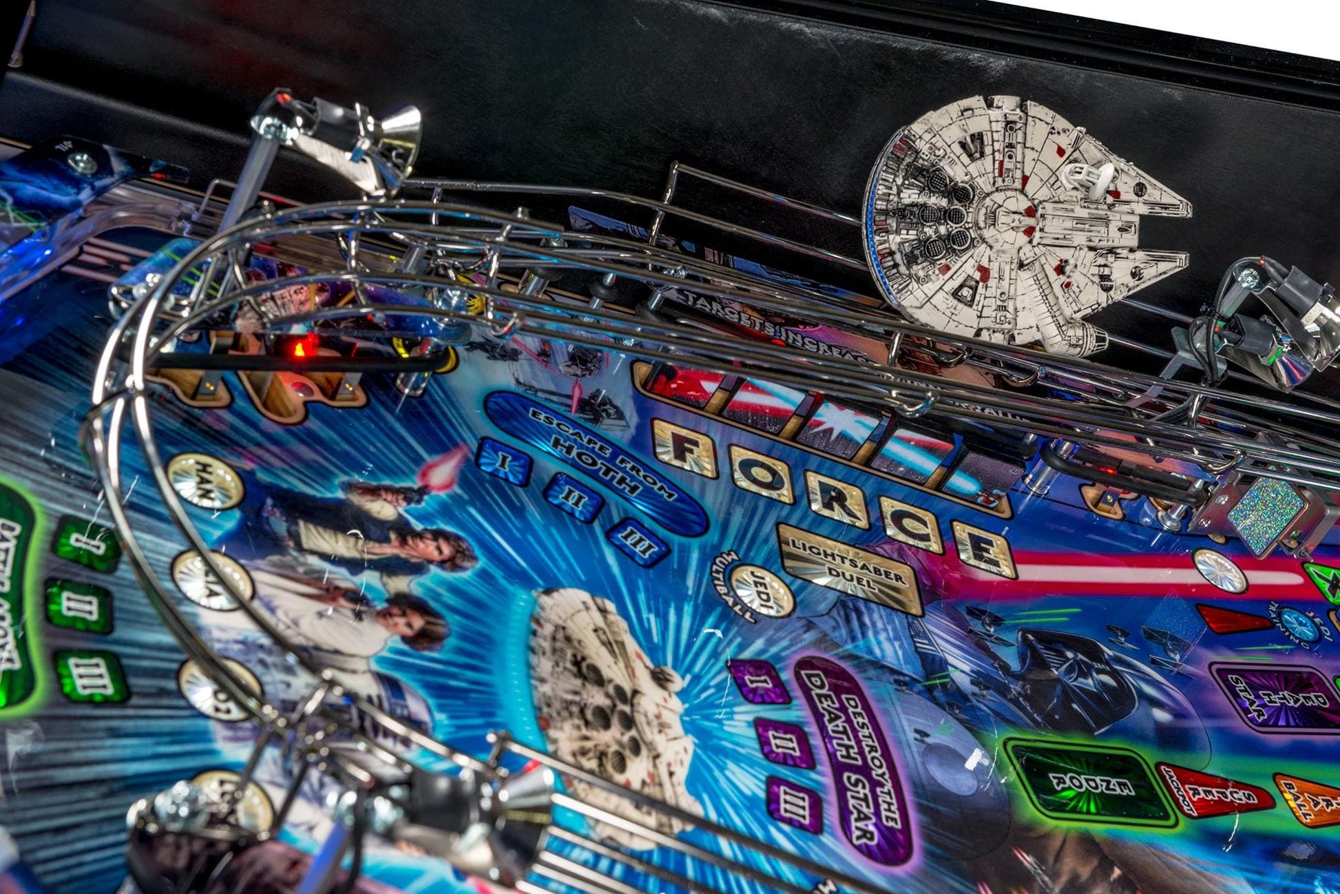 Pinball machine with Millennium Falcon design and various game elements.