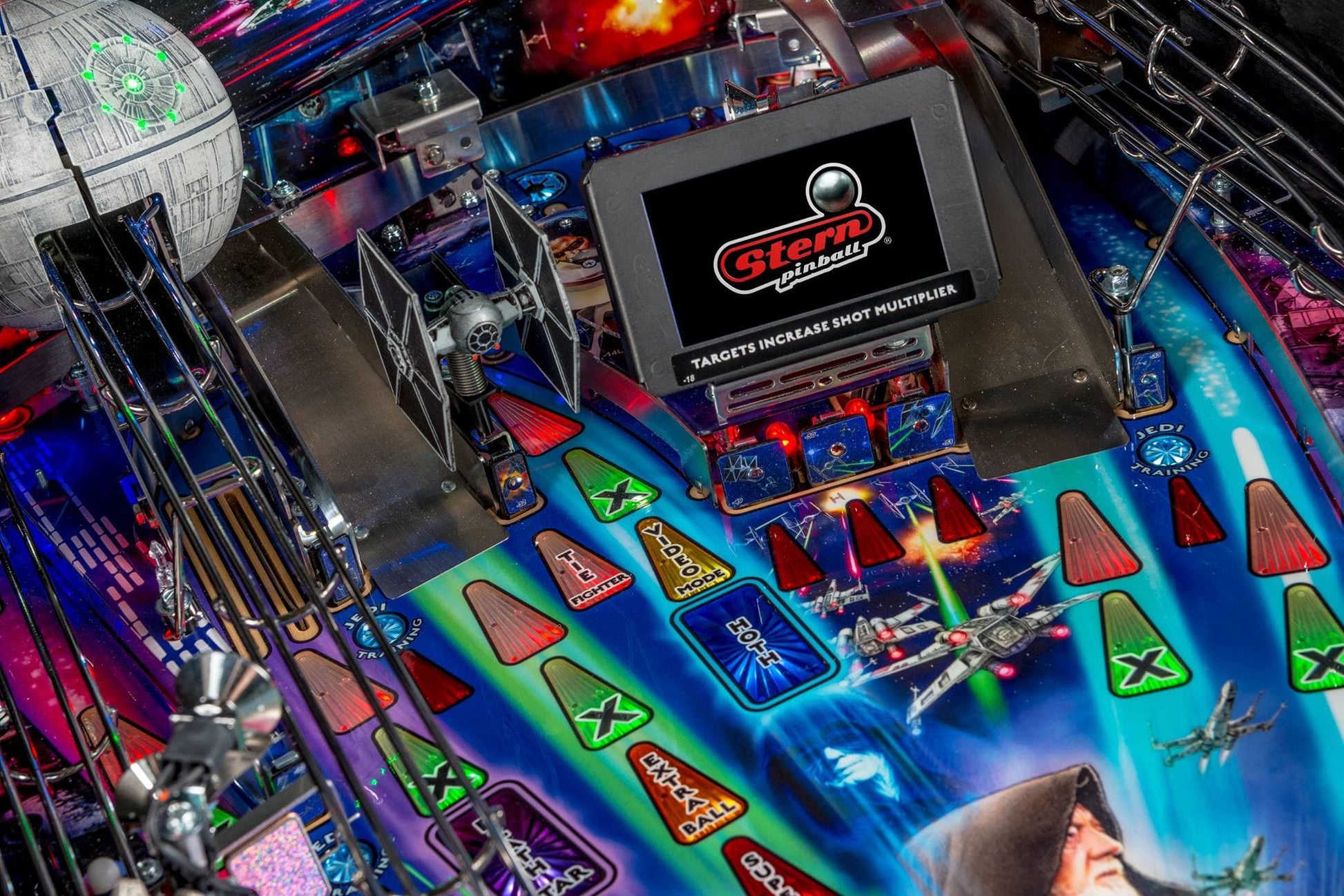 Pinball machine with colorful playfield and Stern logo