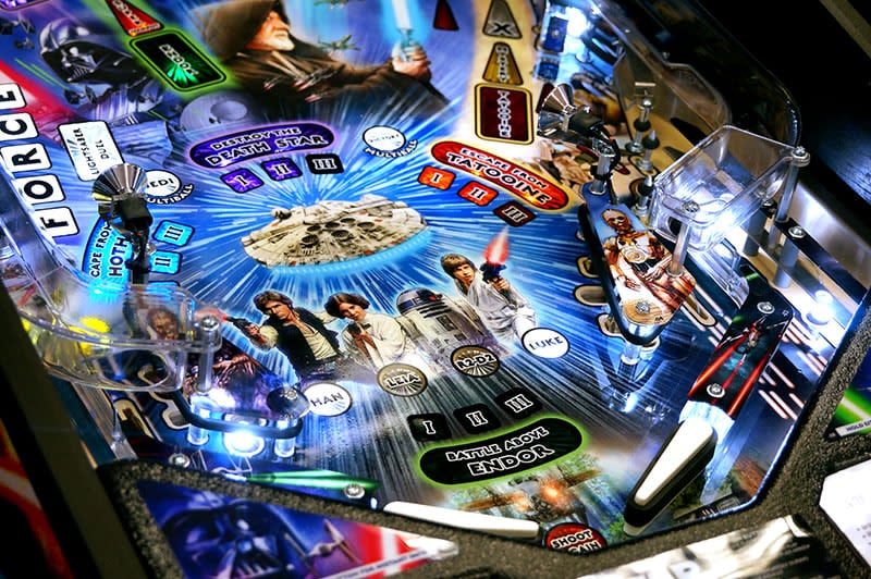 Star Wars-themed pinball machine with colorful graphics and characters.