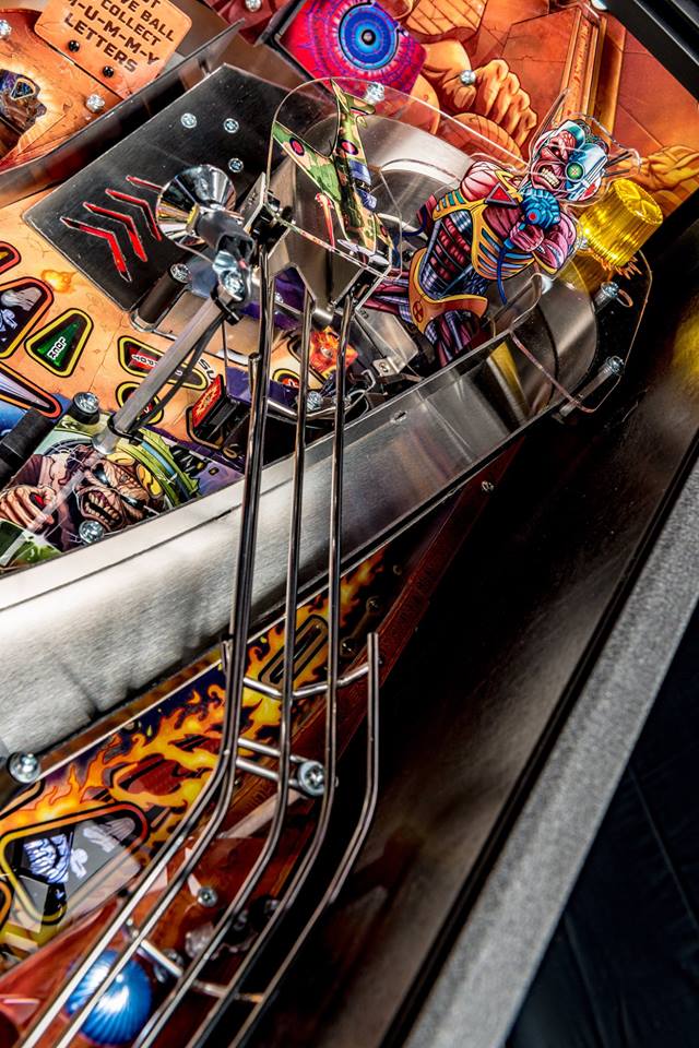 Close-up of a colorful pinball machine with intricate details