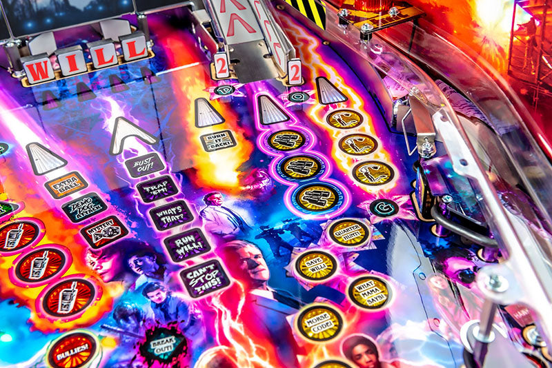 Colorful pinball machine with various buttons and lights