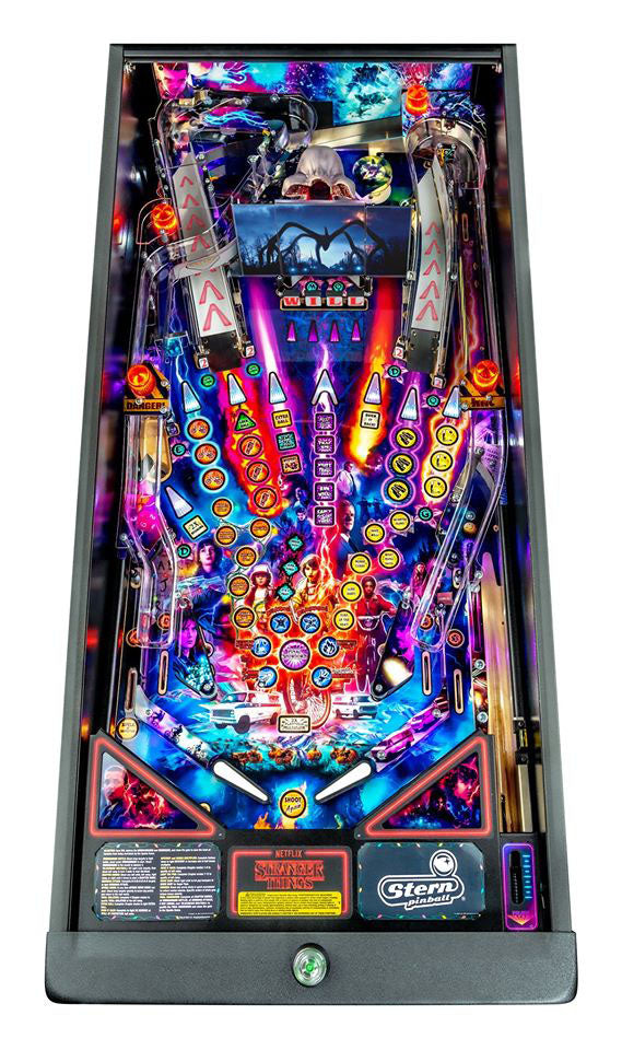 Colorful pinball machine with vibrant lights and details on a white background