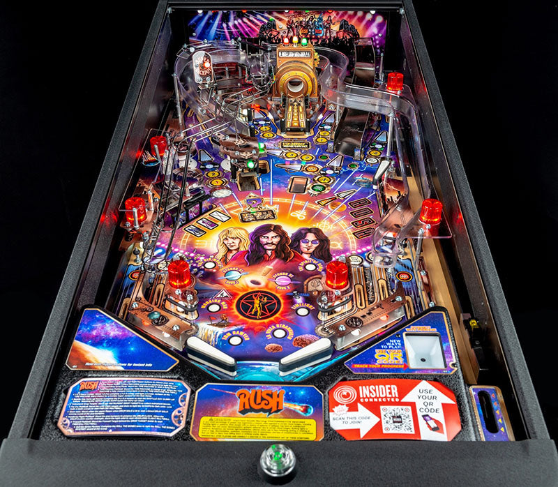 Pinball machine with colourful design and 'Rush' band illustration on a black background