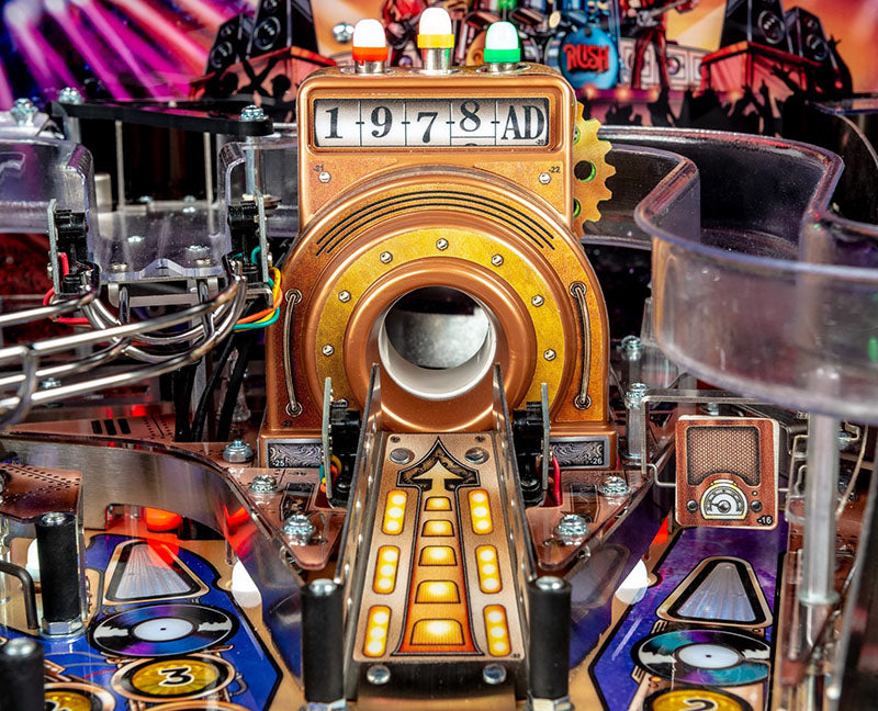Close-up of a pinball machine with intricate details and colourful design.