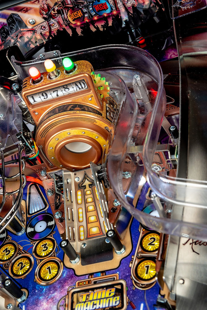 Close-up of a pinball machine with colourful details and 'Time Machine' text. 