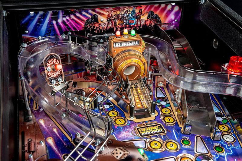 Close-up of a pinball machine with colourful playfield and lights.