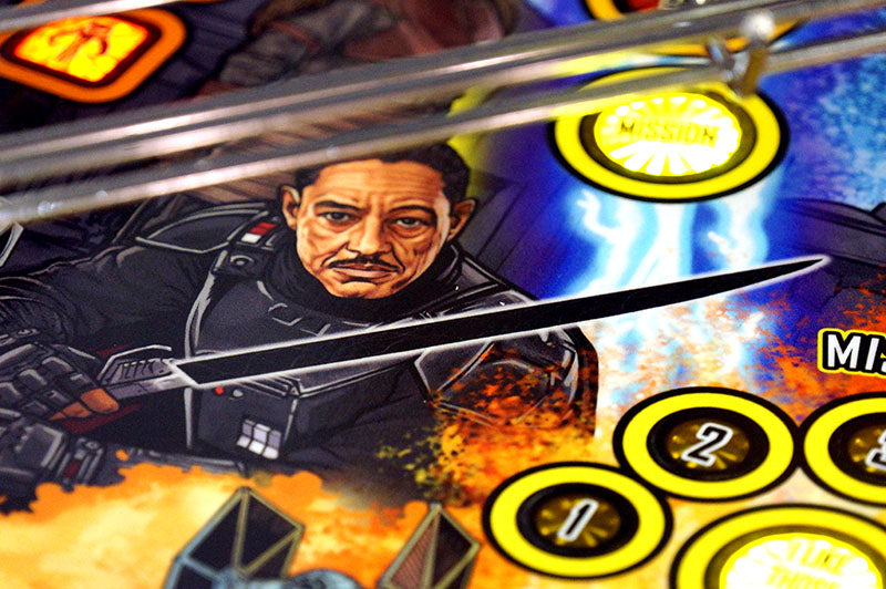 Close-up of a pinball machine with a character and game elements.