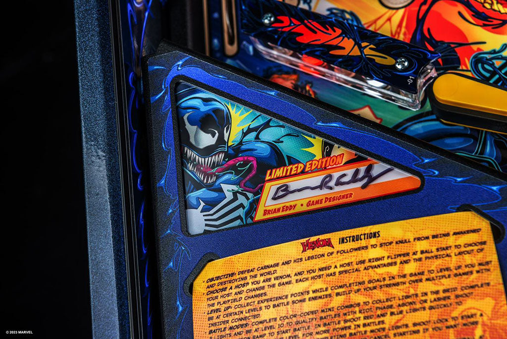 Close-up of a pinball machine with a limited edition label and game instructions.