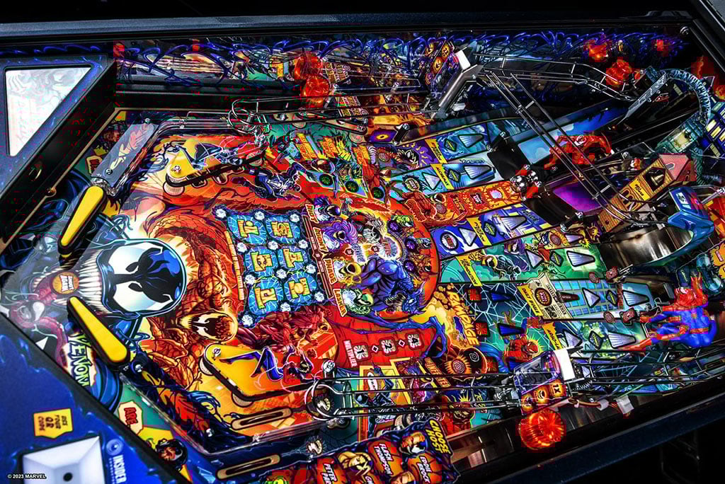Colourful pinball machine with intricate design and various Venom elements.