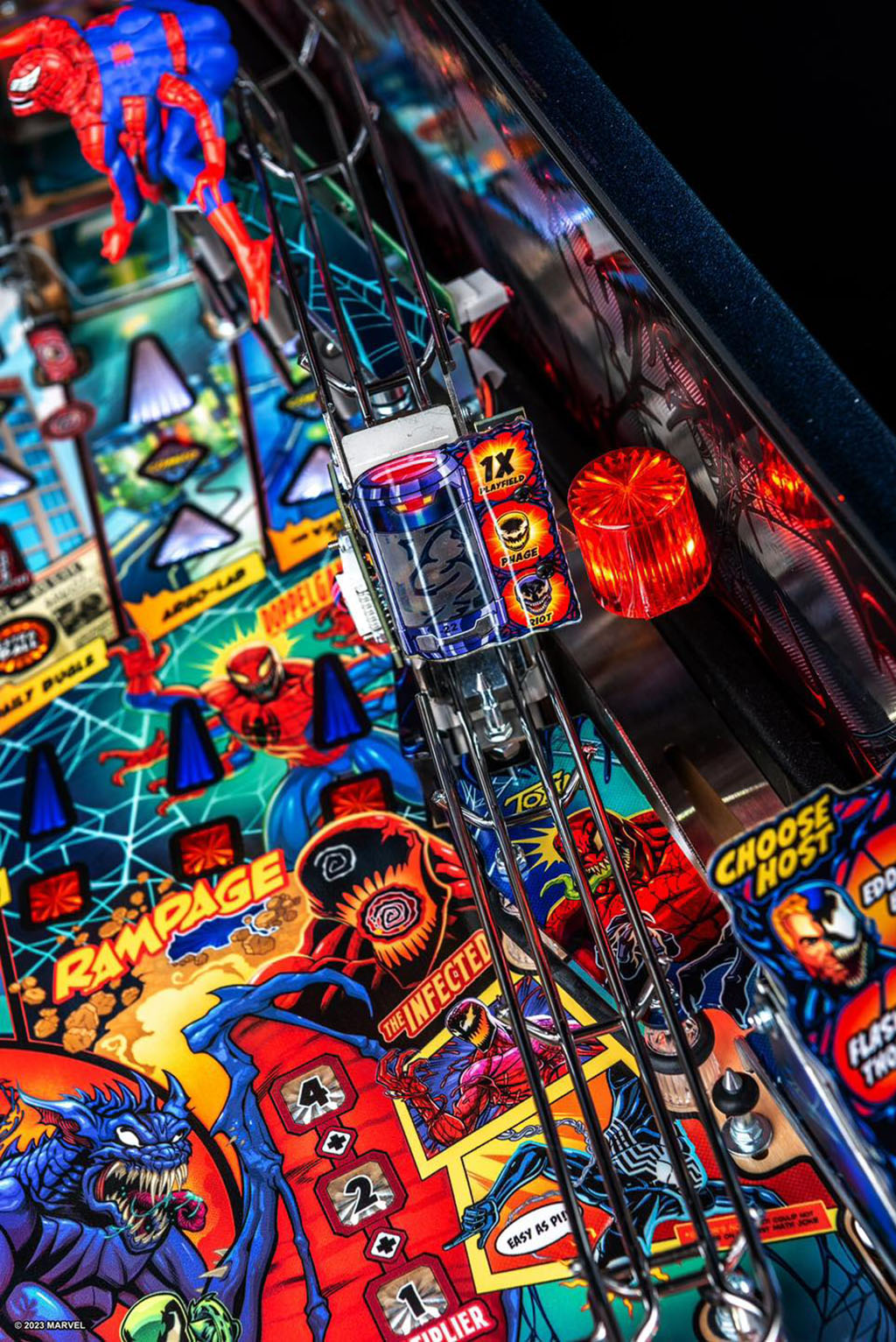 Close-up of a colourful pinball machine with various game elements and characters.
