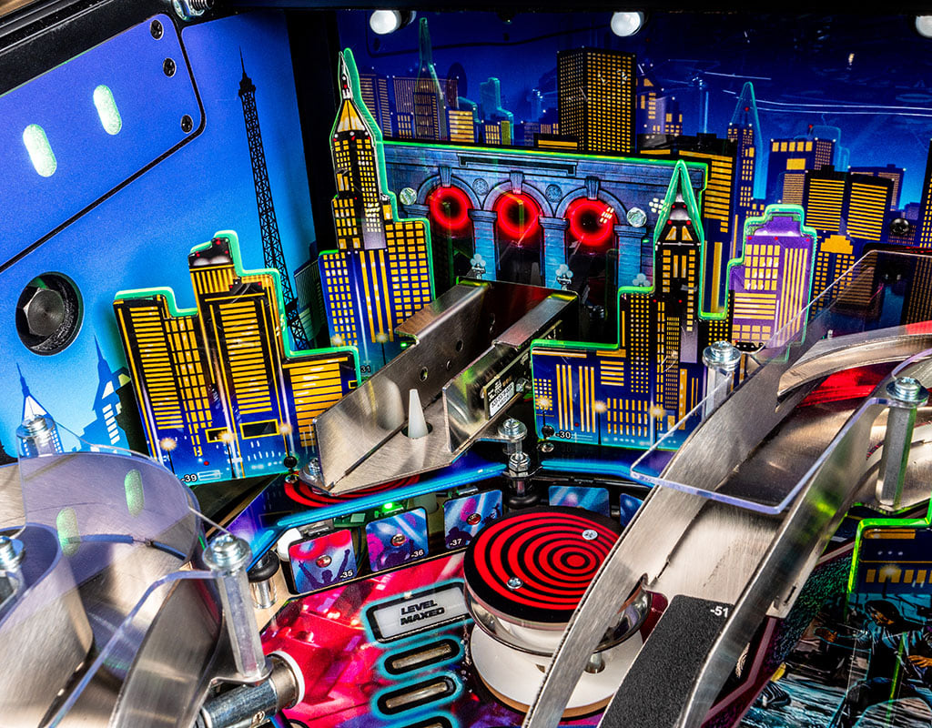 Pinball machine with colorful cityscape background