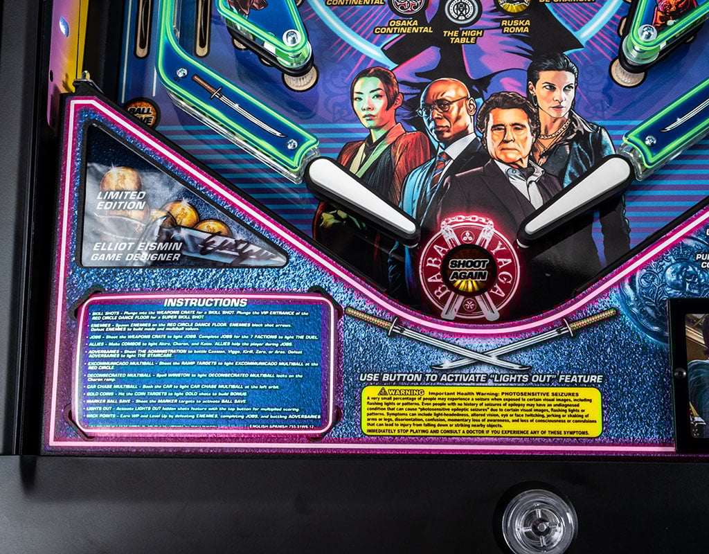 Pinball machine with John Wick branding and character images on a dark background. 