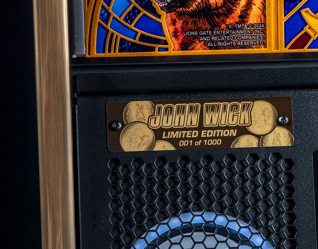 John Wick limited edition pinball machine with honeycomb design and decorative elements.