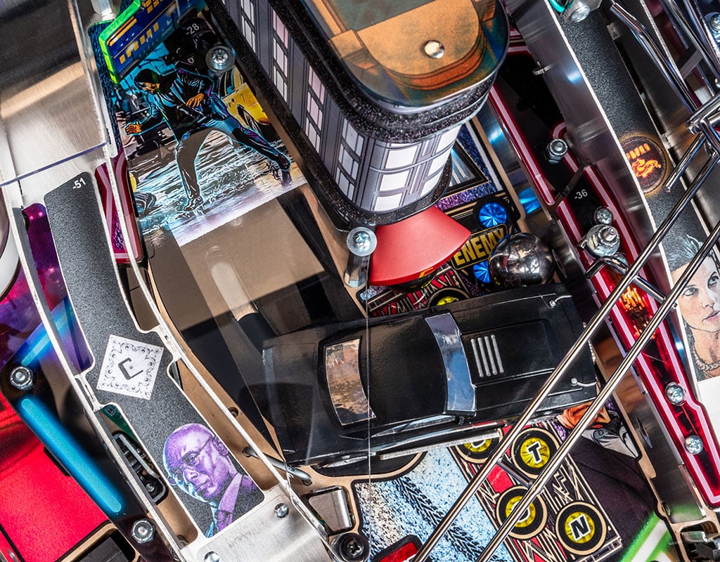 Close-up of a a pinball with various John Wick themed components