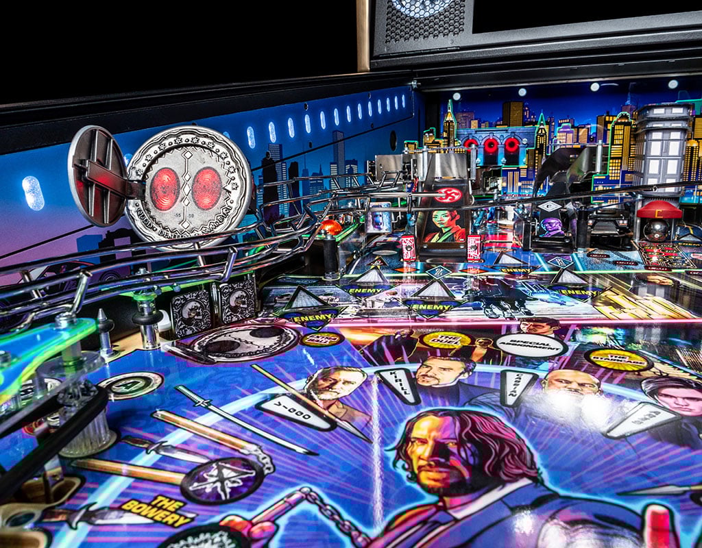 Pinball machine with colourful John Wick design and various elements