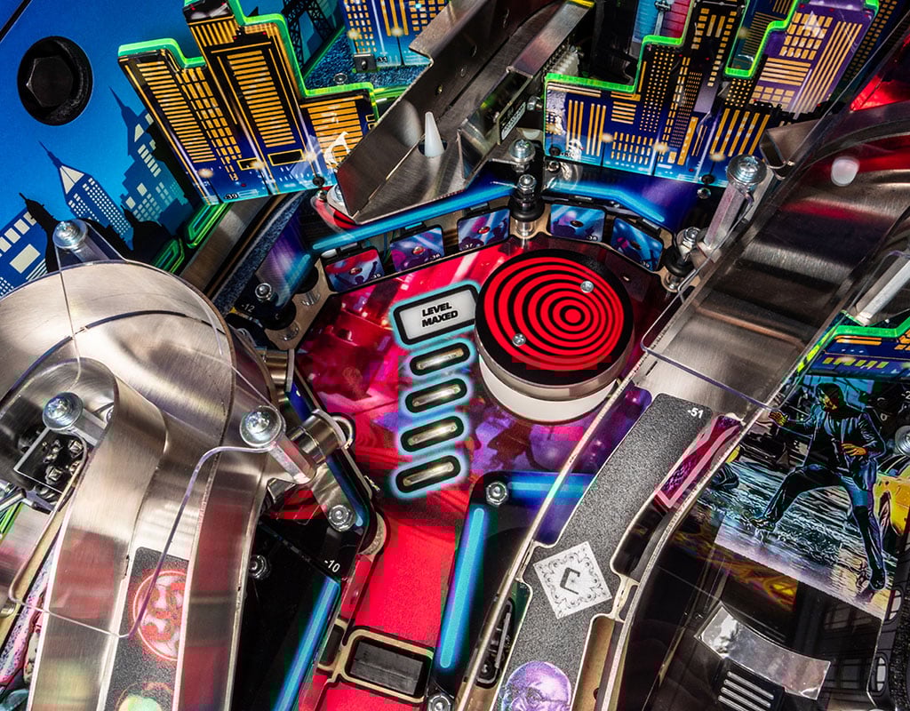 Close-up of a colourful John Wick pinball machine with a red circular design. 