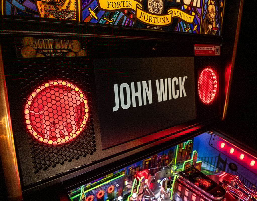 Pinball machine with 'John Wick' branding and colorful display