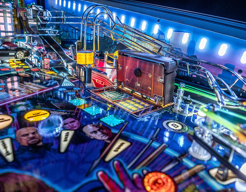 Close-up of a pinball machine with vibrant colors and lights.