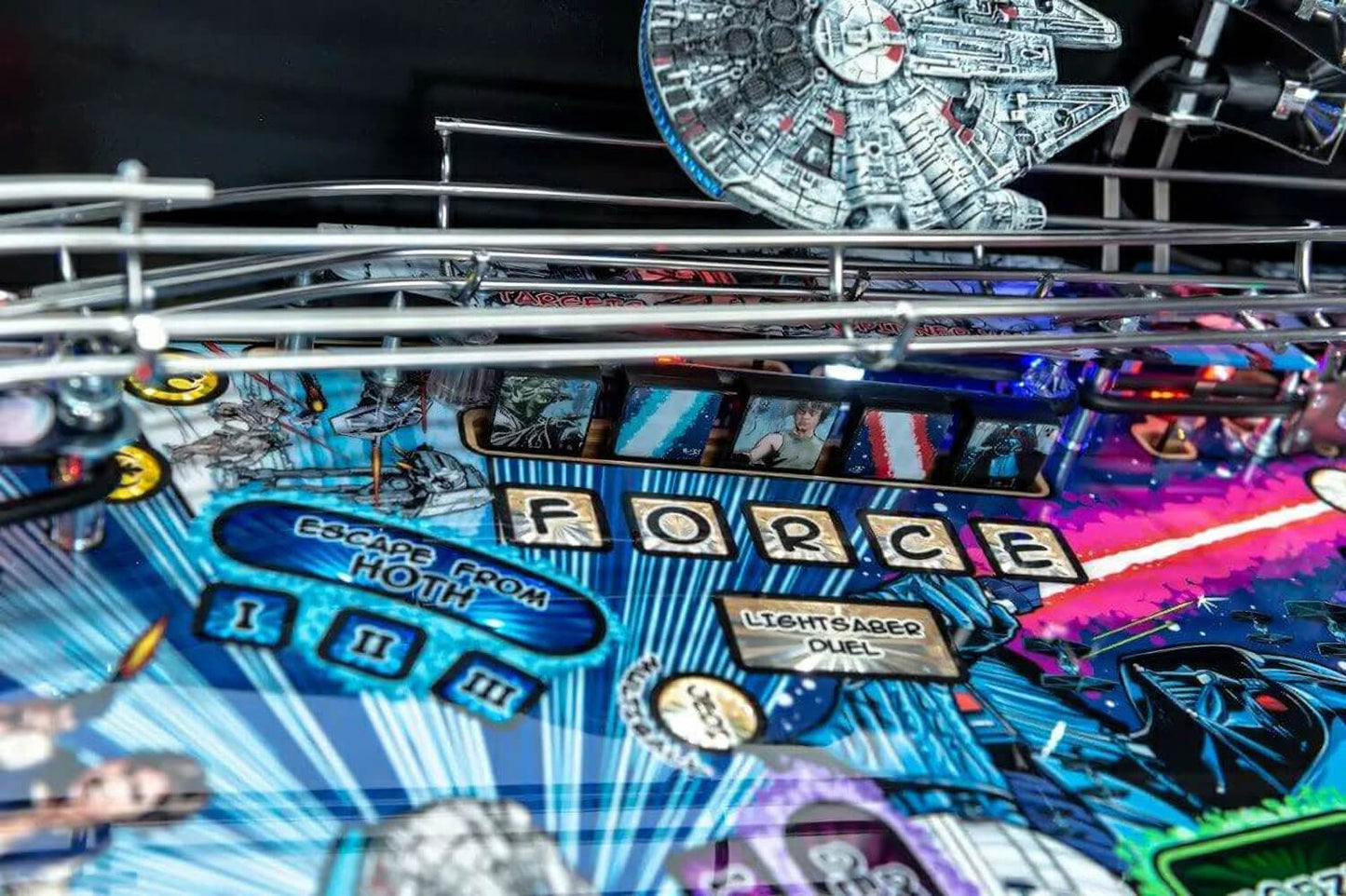 Pinball machine with 'Star Wars' theme featuring the Millennium Falcon and 'Force' text.