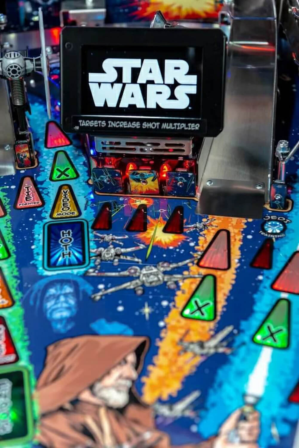 Pinball machine with 'Star Wars' theme featuring colourful playfield and character figures.