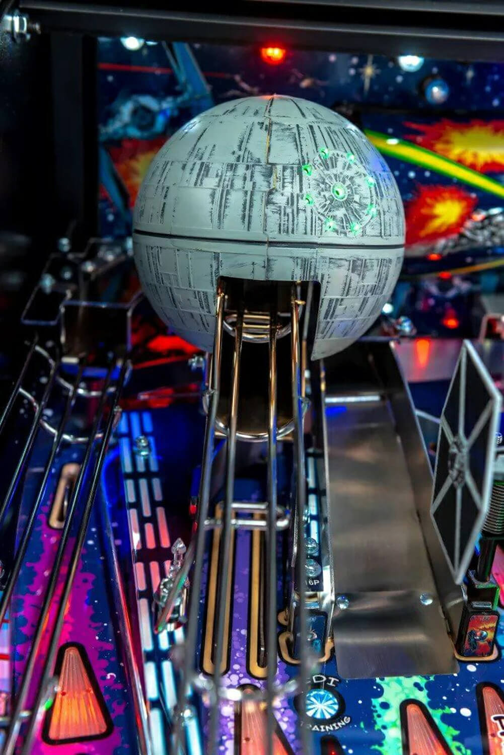 Pinball machine with a Death Star model on top