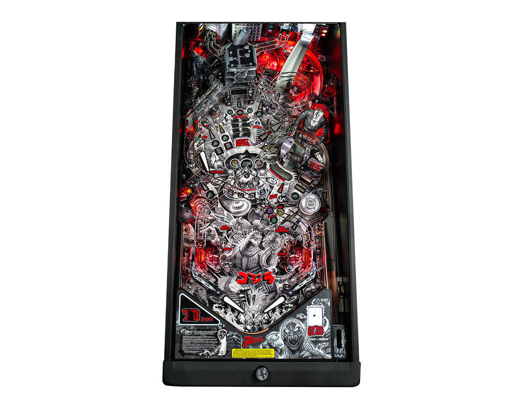 Pinball machine with intricate design and red accents on a white background