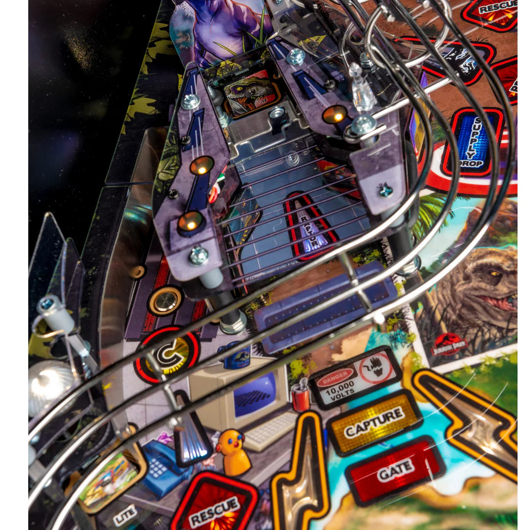 Close-up of a pinball machine with colorful artwork and game elements.
